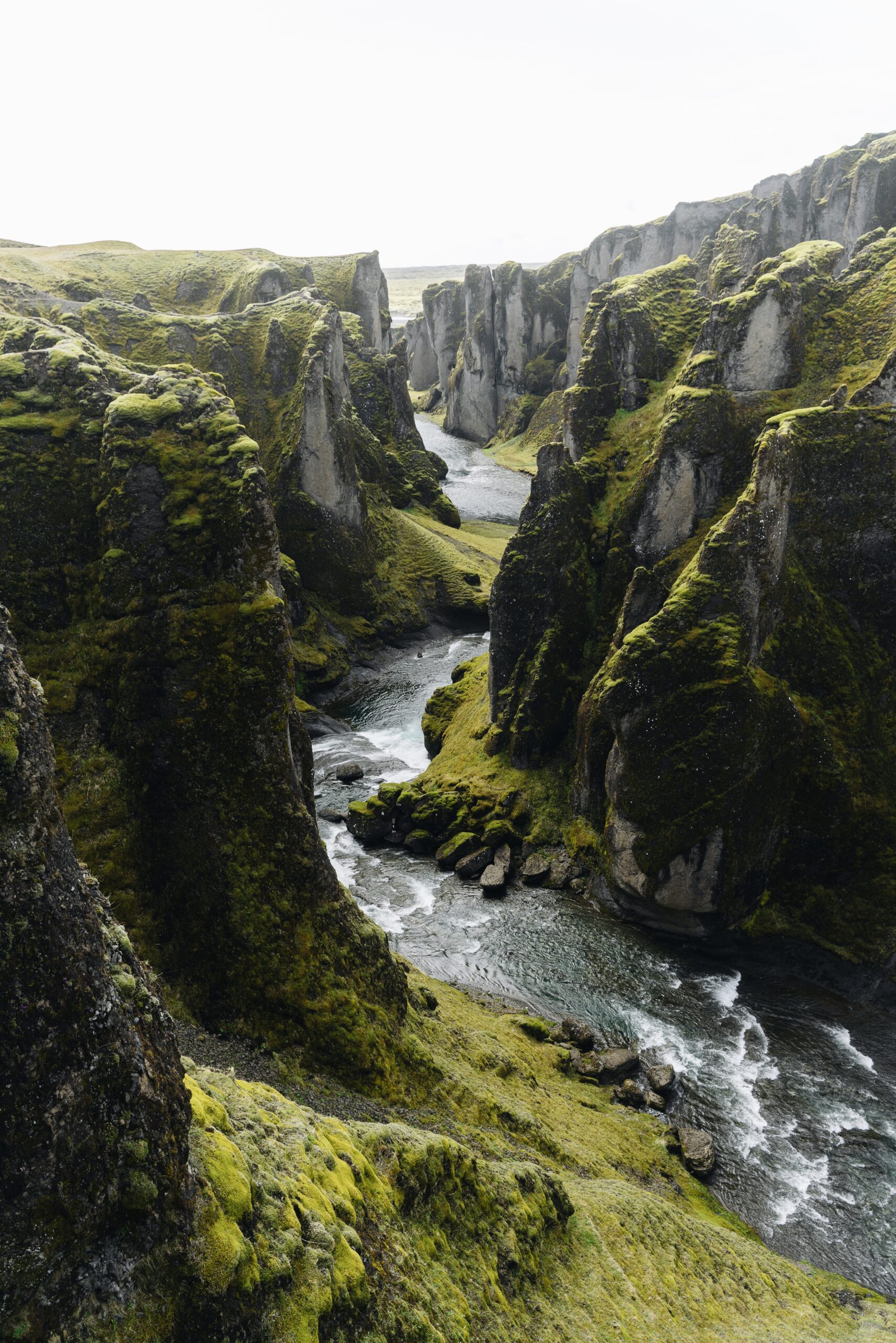 Djordje Vukojicic Photography showcases the beauty of nature with a captivating image of a river gracefully running through a rocky canyon.