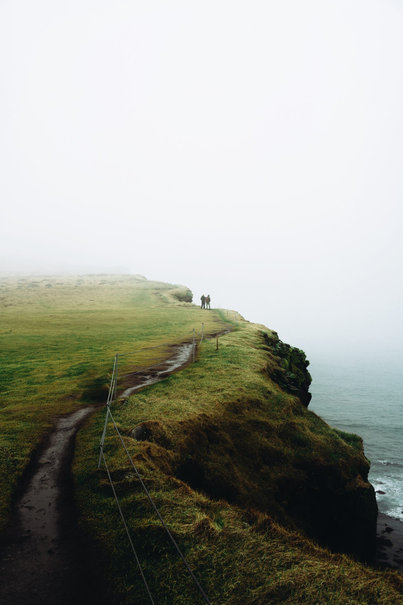  Explore the scenic wonders through the lens of Djordje Vukojicic Photography, featuring a breathtaking path on a cliff, offering panoramic views of a tranquil body of water.