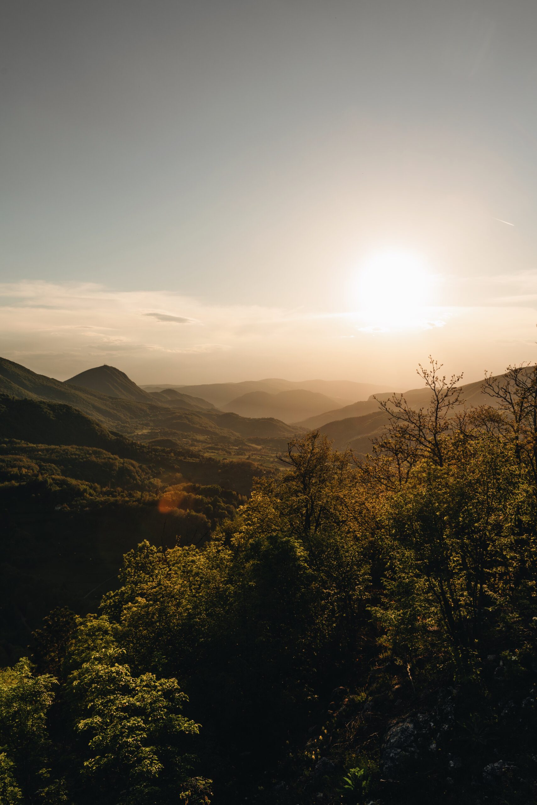 Djordje Vukojicic Photography showcases the majesty of nature with a captivating landscape featuring towering mountains and lush trees.