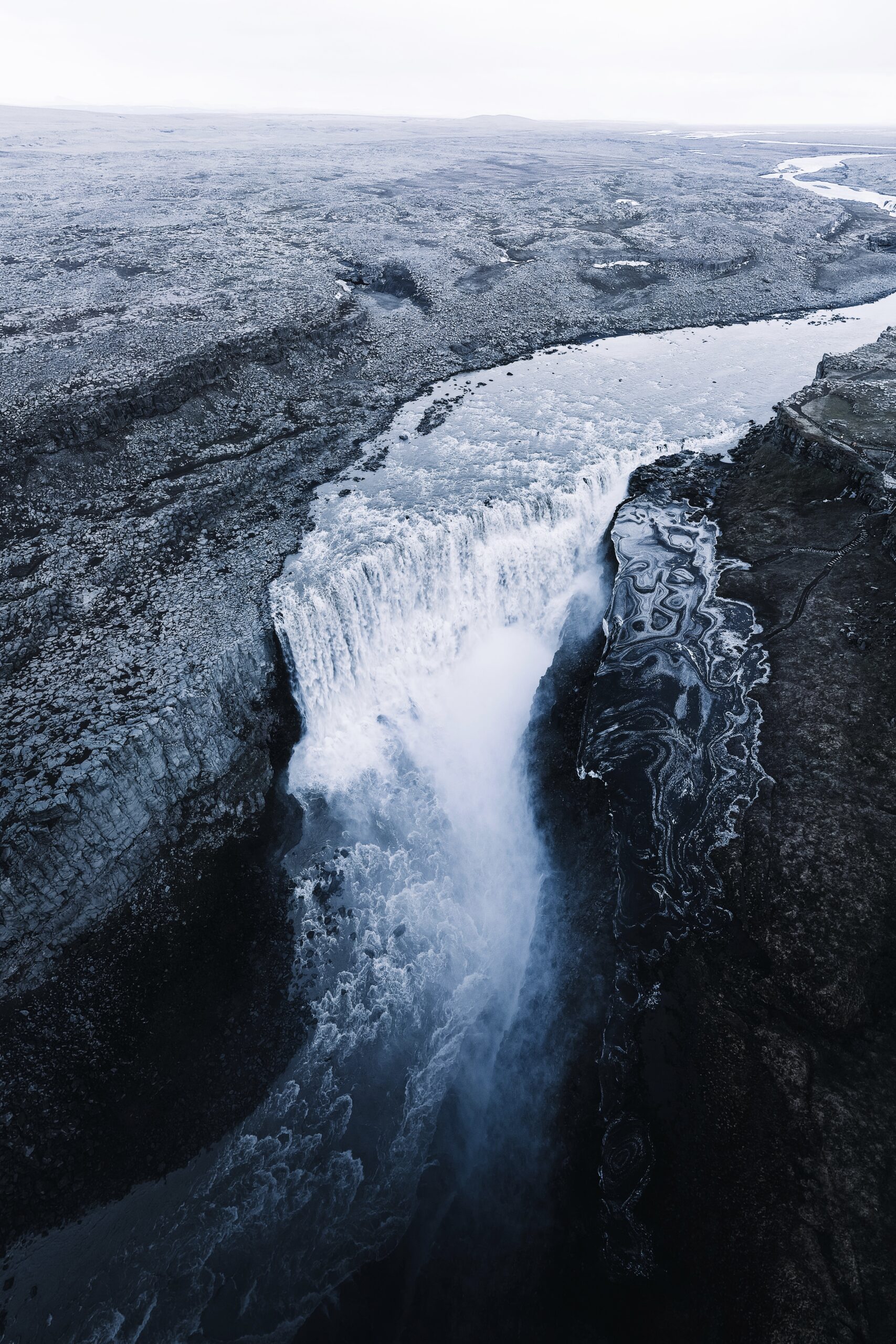 Immerse yourself in the beauty of flowing water with Djordje Vukojicic Photography - a captivating scene featuring a waterfall gracefully situated in the middle of a serene river.