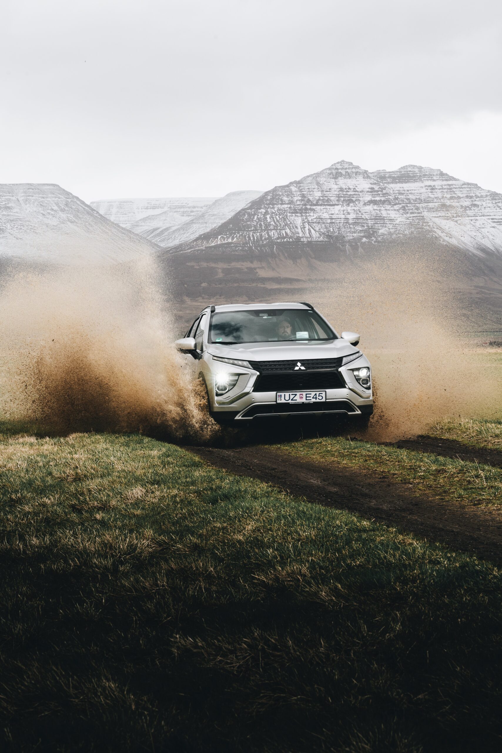 Explore the road less traveled with Djordje Vukojicic Photography - a captivating image of a car traversing a rustic dirt road in the midst of nature.